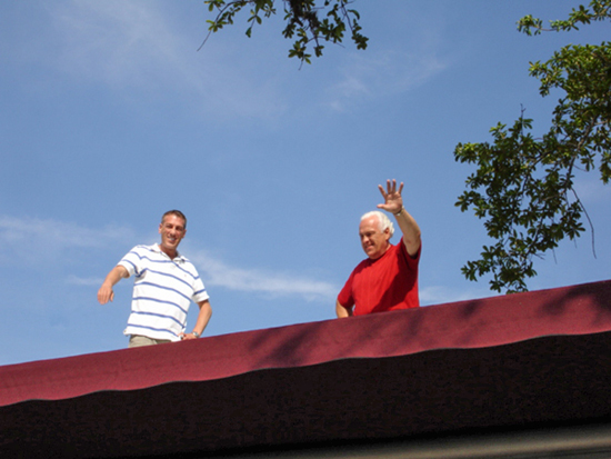 Lee and Brian Duquette on top of the RV